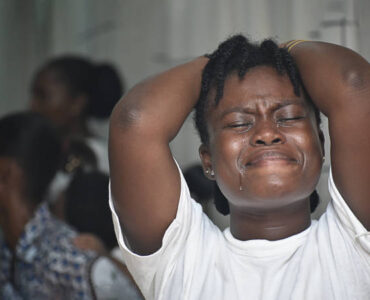 Close up portrait of black crying woman